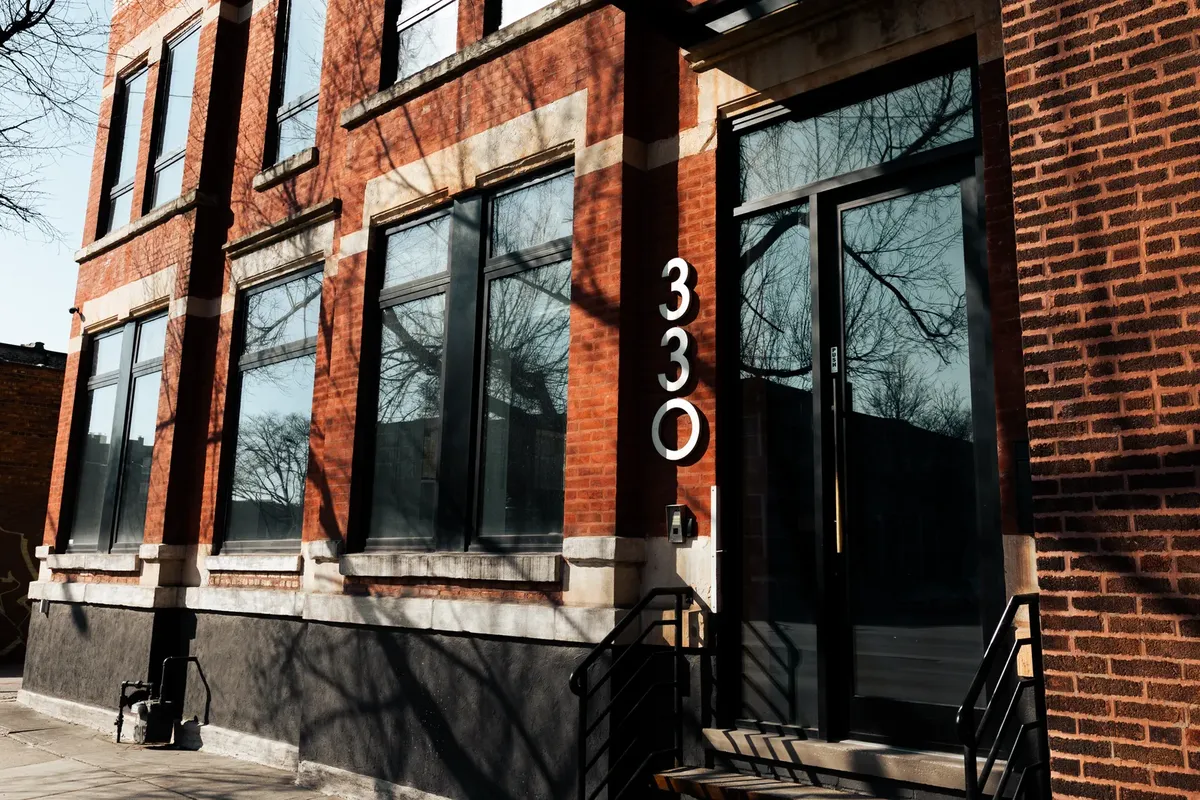 EMSC headquarters at 330 N. Ashland Ave., Chicago, red brick facade with the 330 address numbers beside the entrance